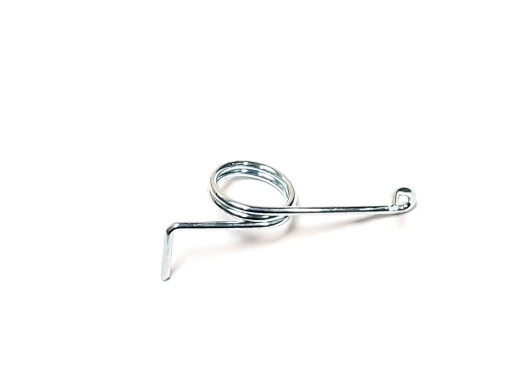 Tensioner torsion spring